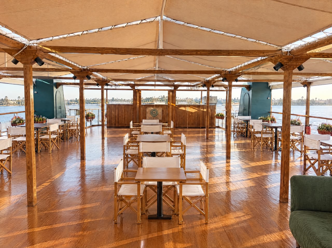 Sun ’n’ Spice outdoor dining tables under the shaded canopy