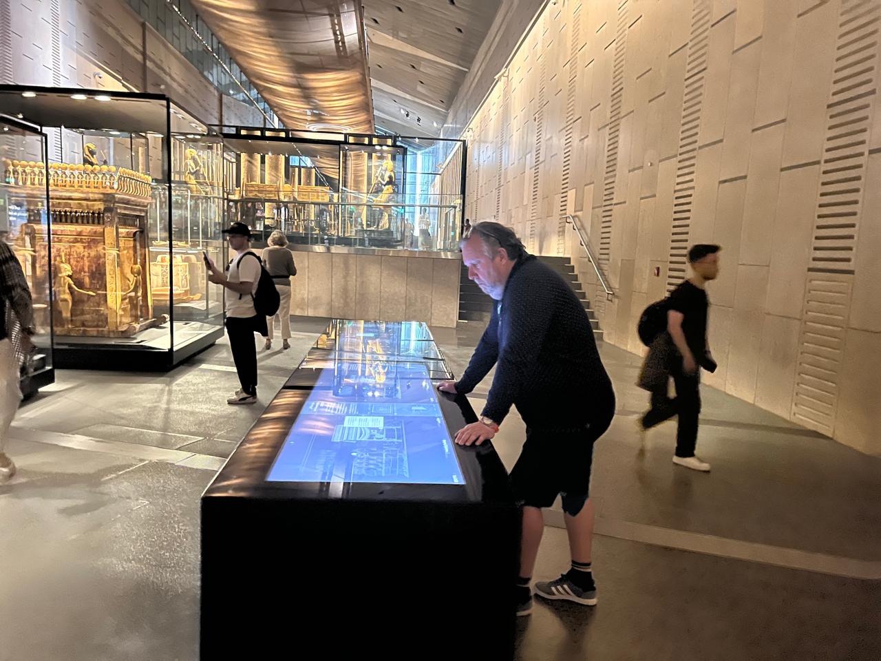 Tour operator inspecting the Tutankhamun galleries at the Grand Egyptian Museum