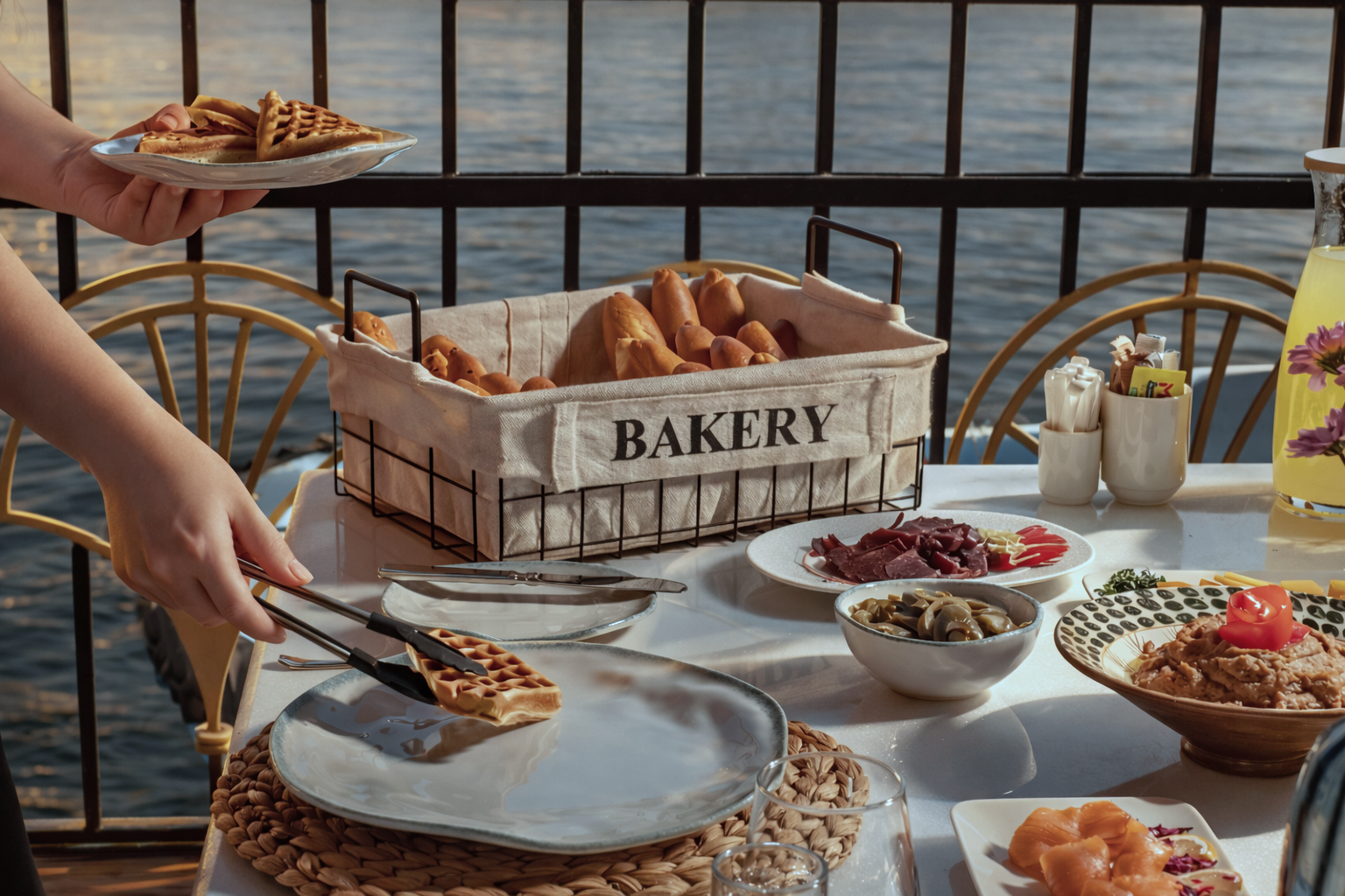 Fresh bakery basket of breads and waffles served riverside aboard Cleo Dahabiya on the Nile