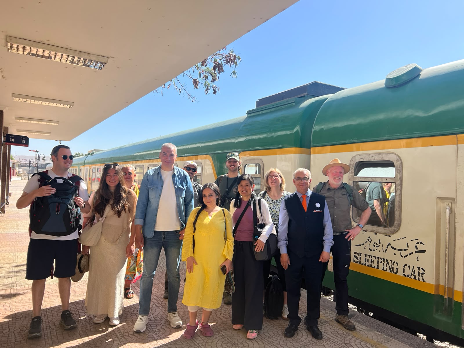 Guests gathered beside the Abela sleeping car on the platform in Upper Egypt