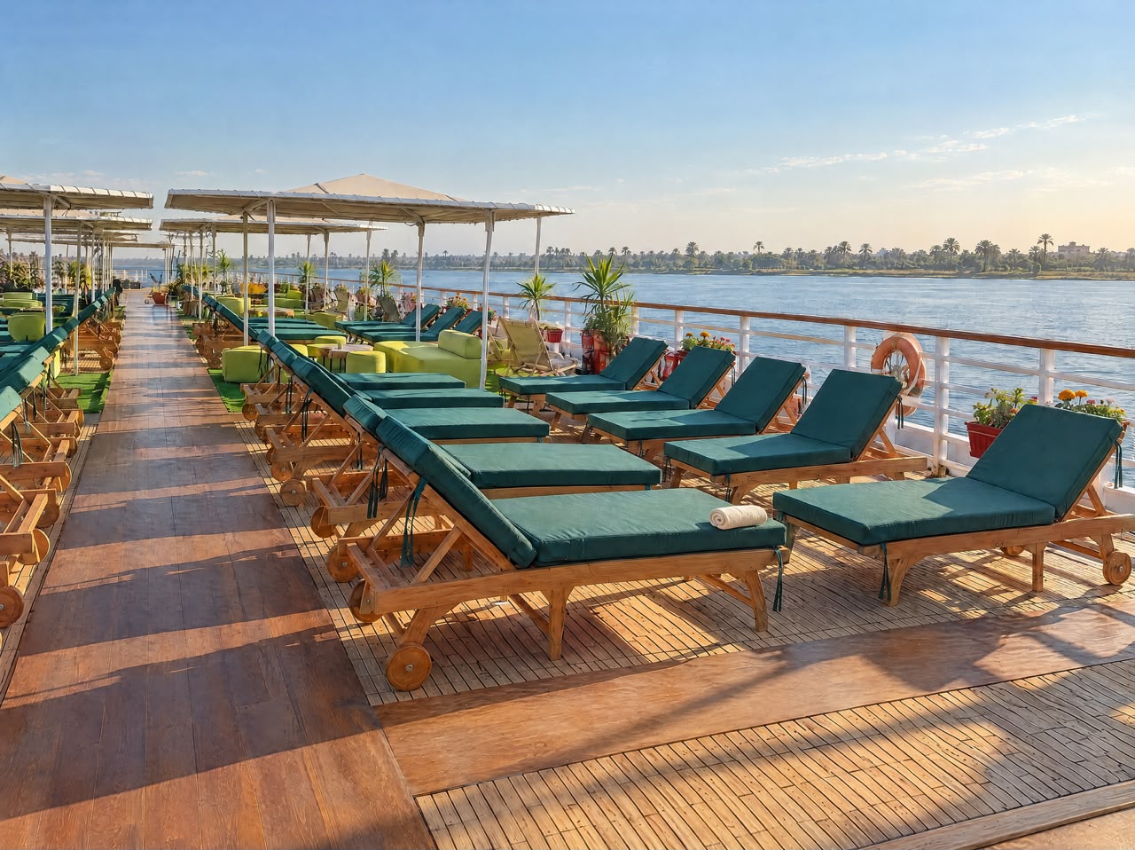 Sundeck loungers along the railing with Nile views, representative imagery of Q Nile