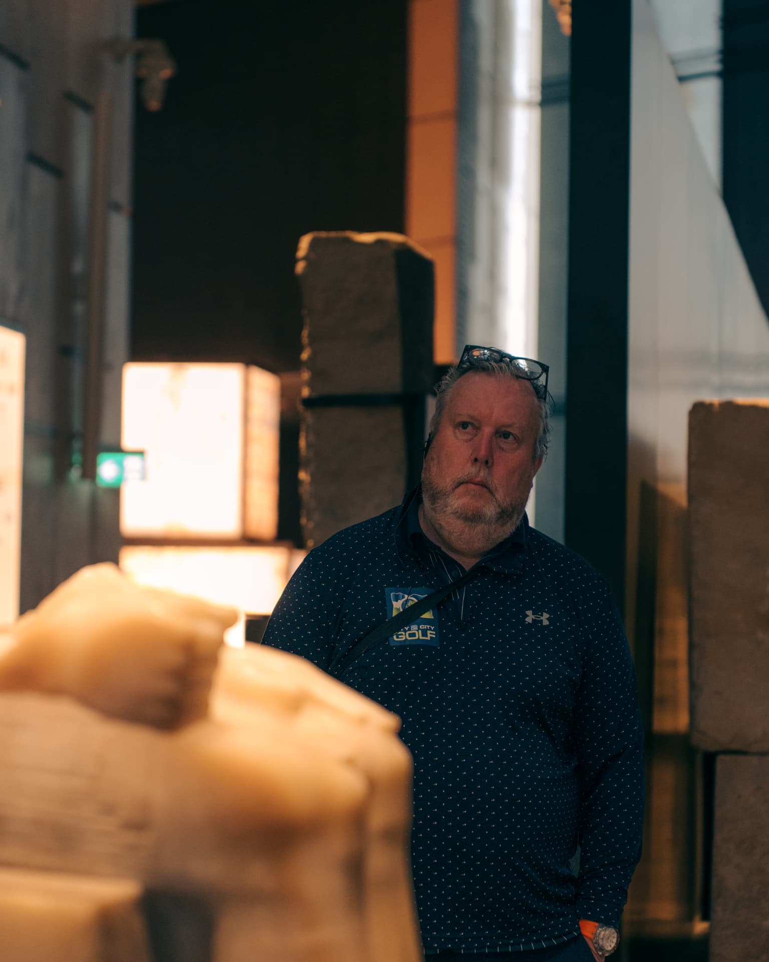 Golf tour operator among monumental statues at the Grand Egyptian Museum
