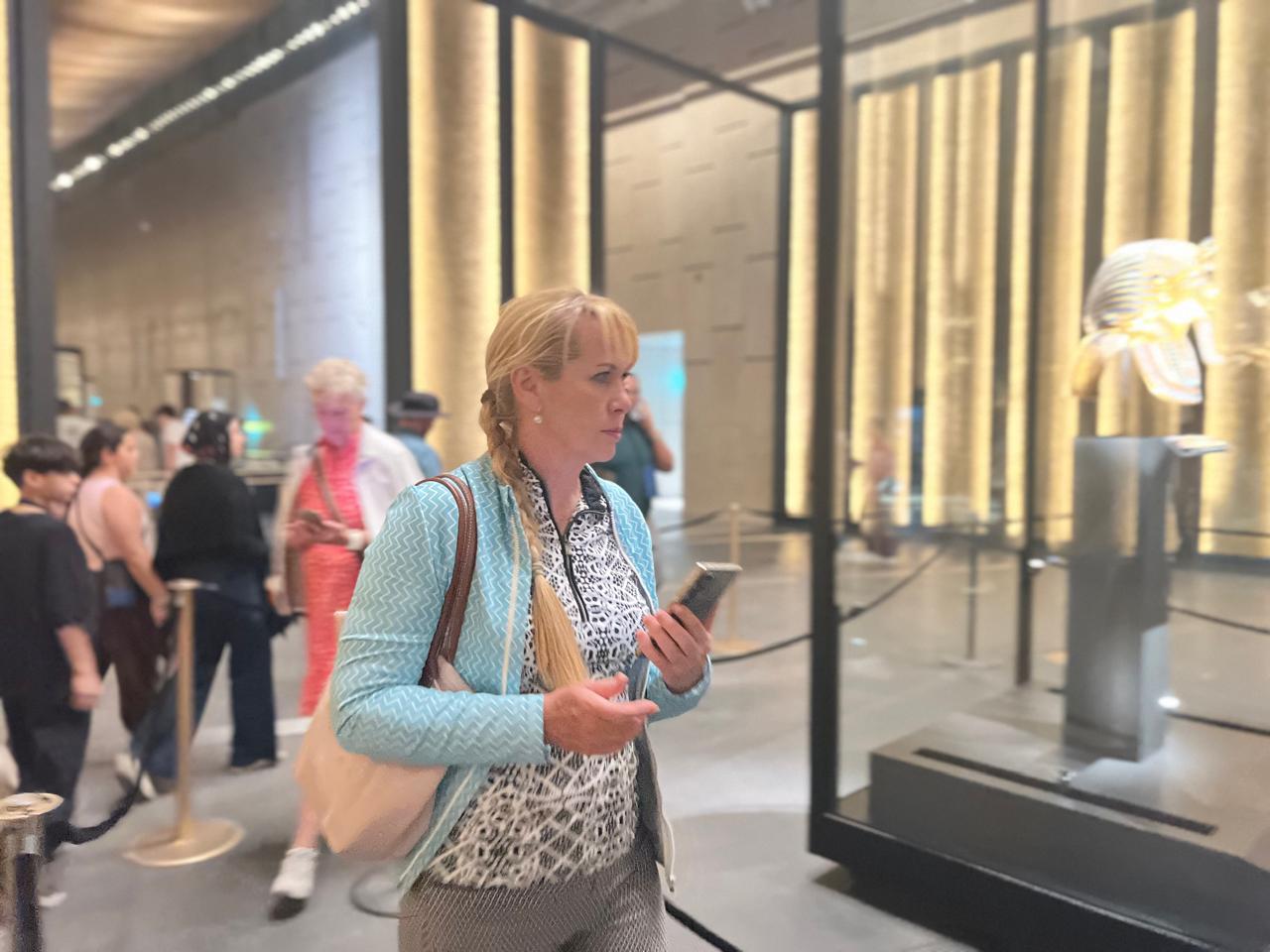 Travel advisor in the Tutankhamun hall of the Grand Egyptian Museum