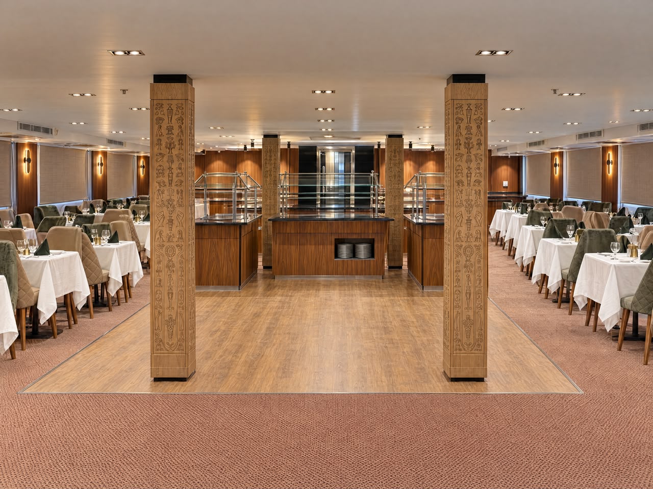 Main restaurant buffet station between carved columns, representative imagery of Q Nile