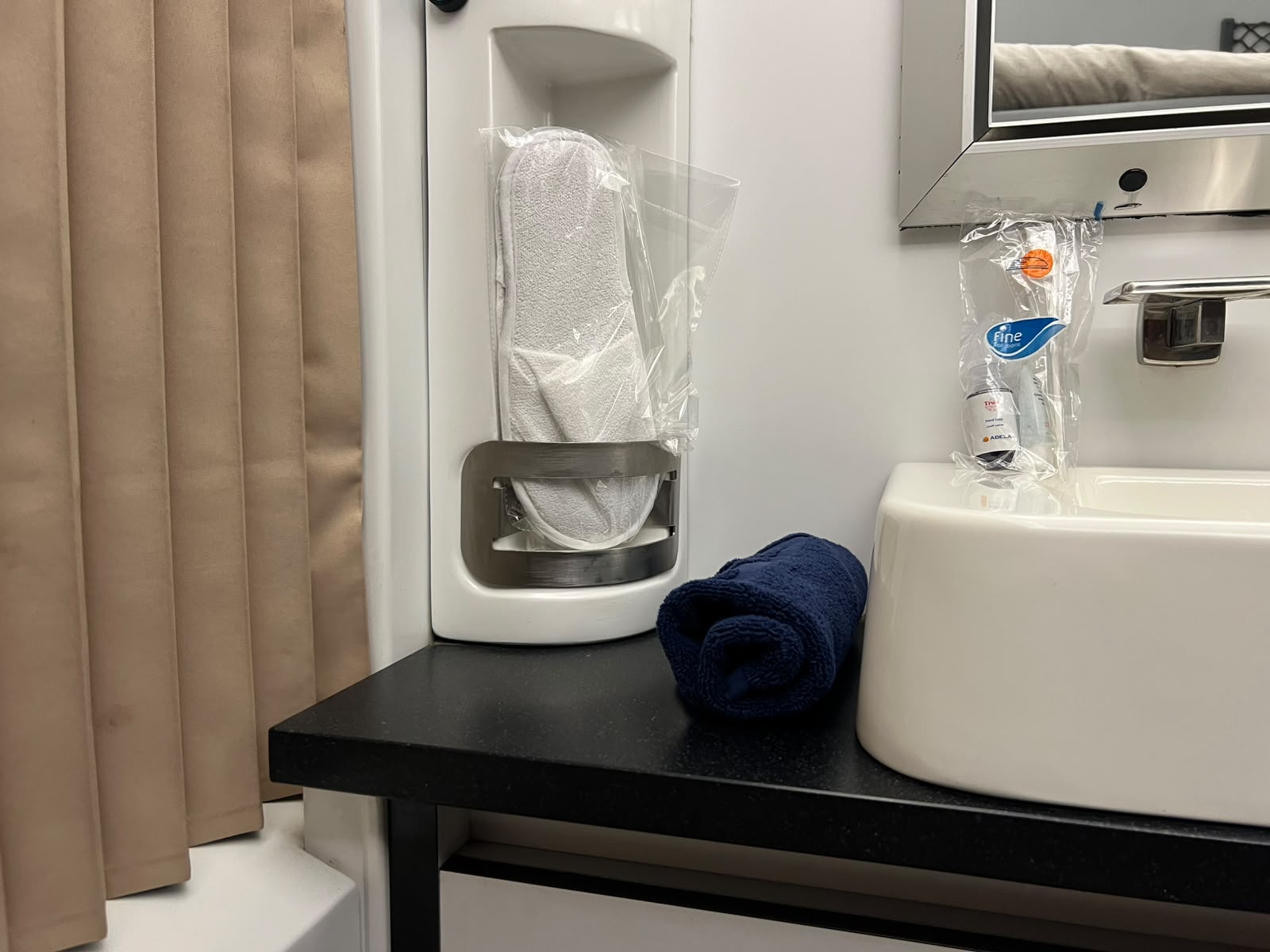 Private washbasin and amenities in a sleeper train cabin