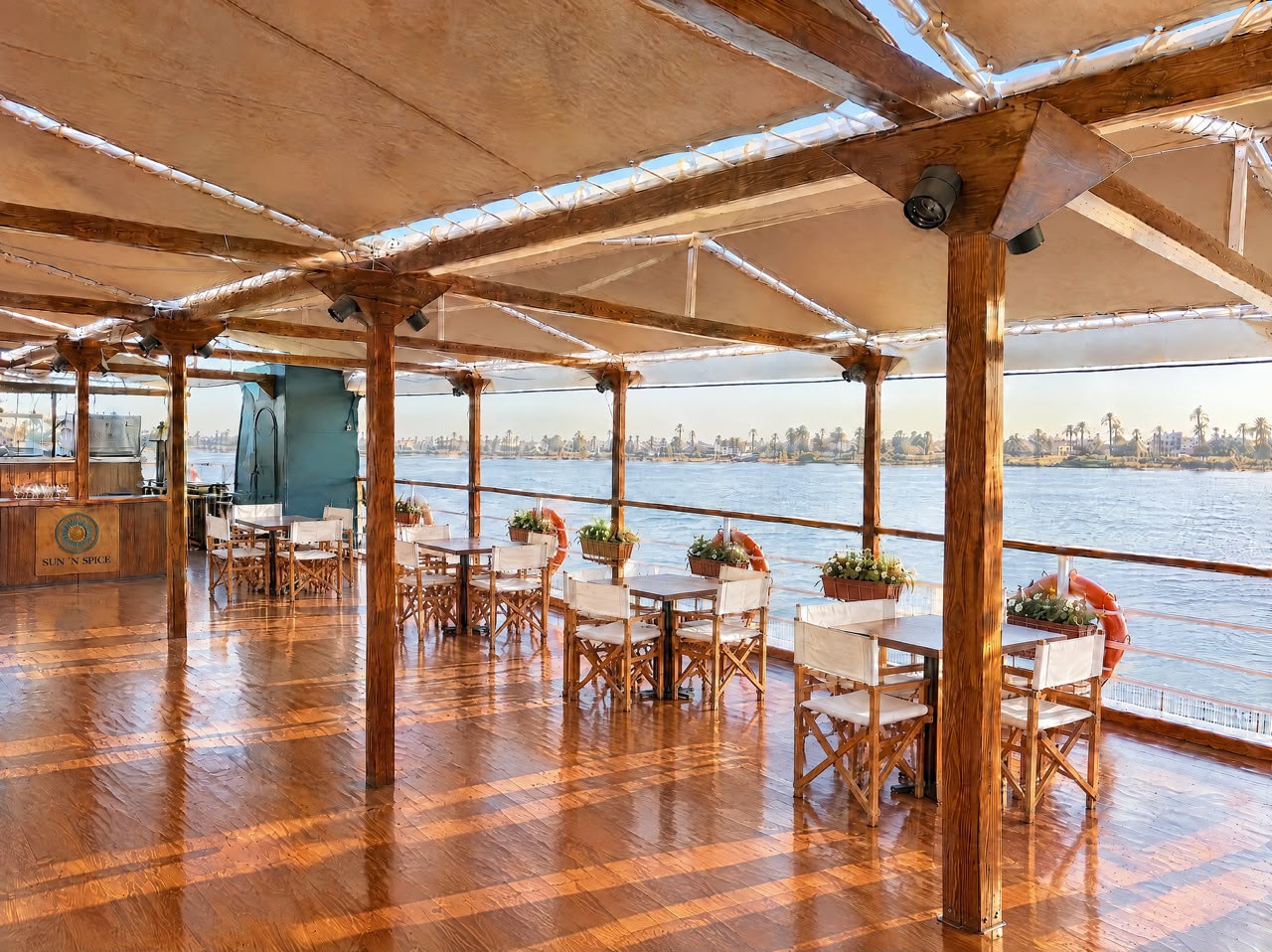 Sun ’n’ Spice outdoor restaurant with shaded timber deck and river views