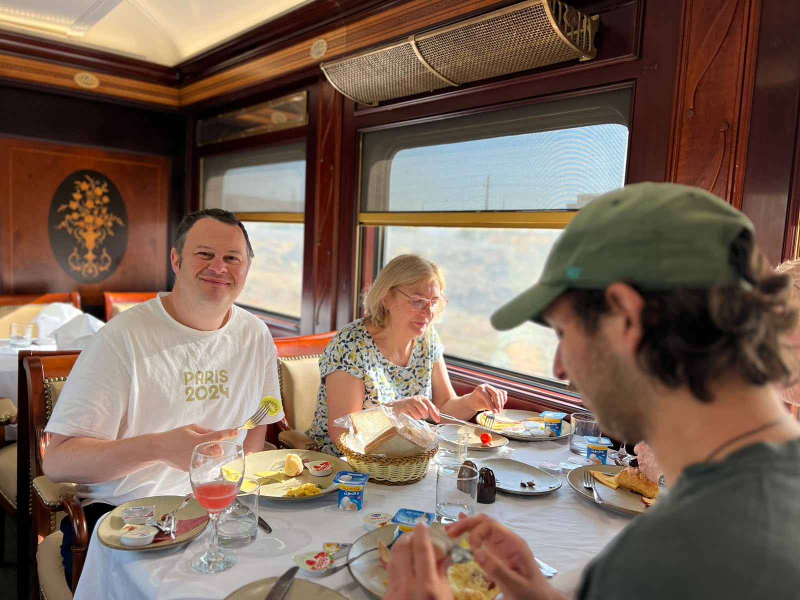 Travellers enjoying breakfast aboard the Cairo to Aswan sleeper train